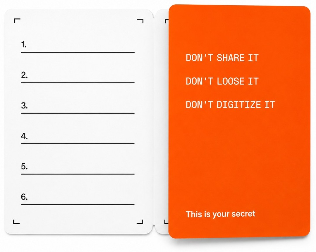 An open Ledger recovery sheet — a blank numbered 1–6 list beside 'Don't share it, don't lose it, don't digitize it — this is your secret'